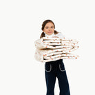 London@kid holding the london ball pit folded up