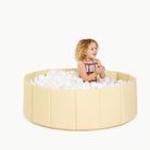 Mellow@little girl playing in ball pit