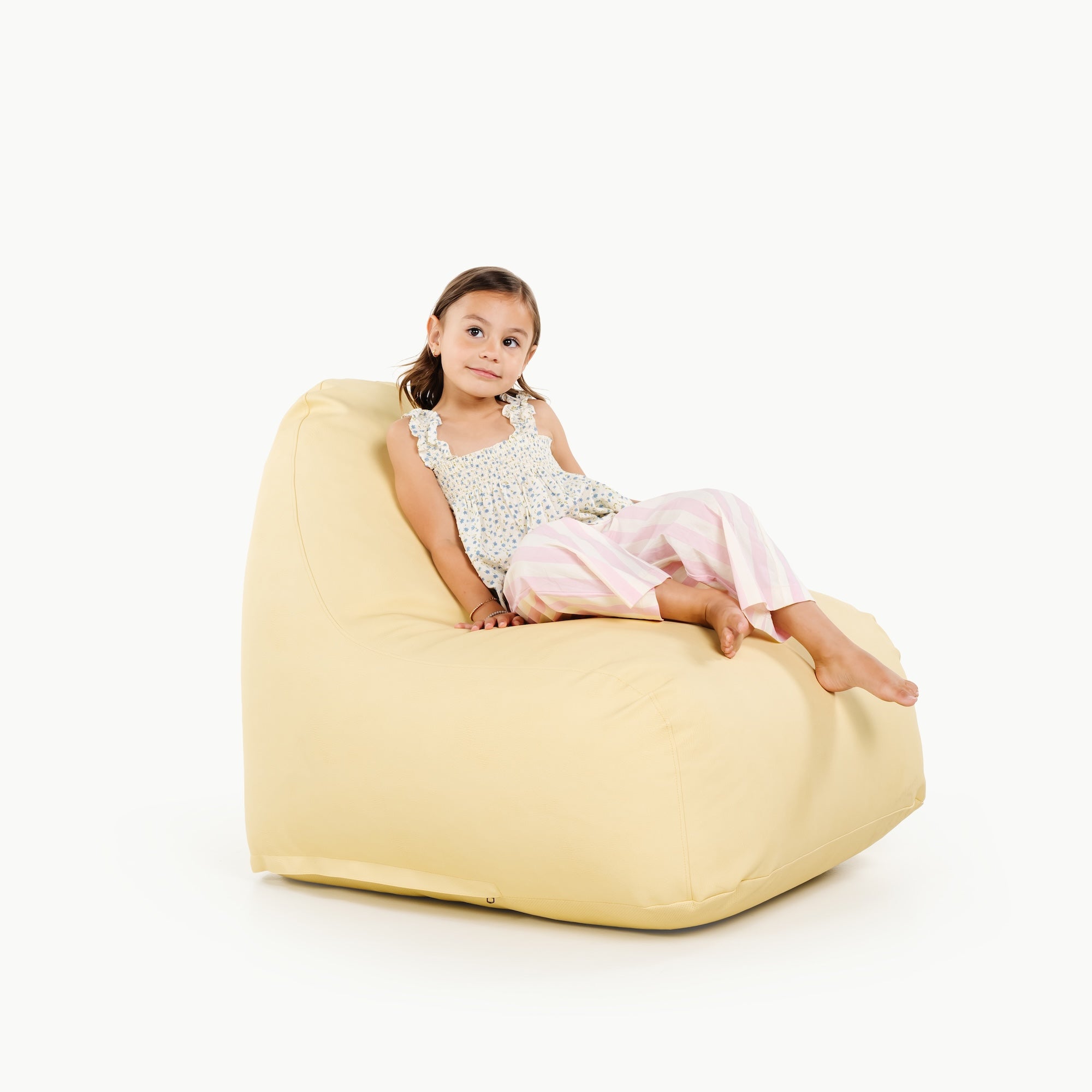Mellow@little girl sitting on lounger
