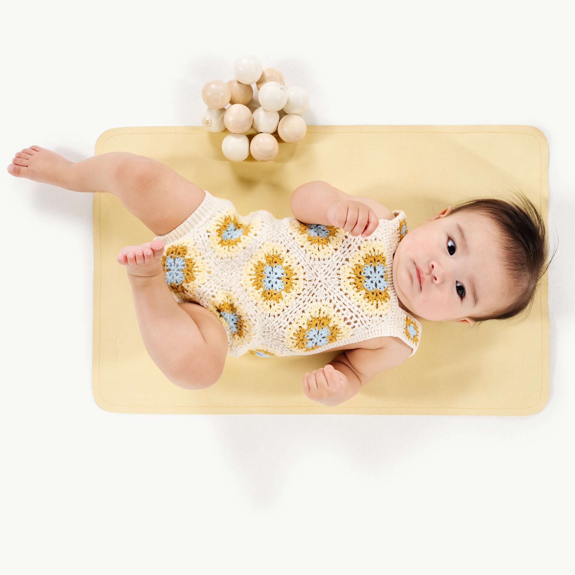 Mellow@baby lying on micro changing mat
