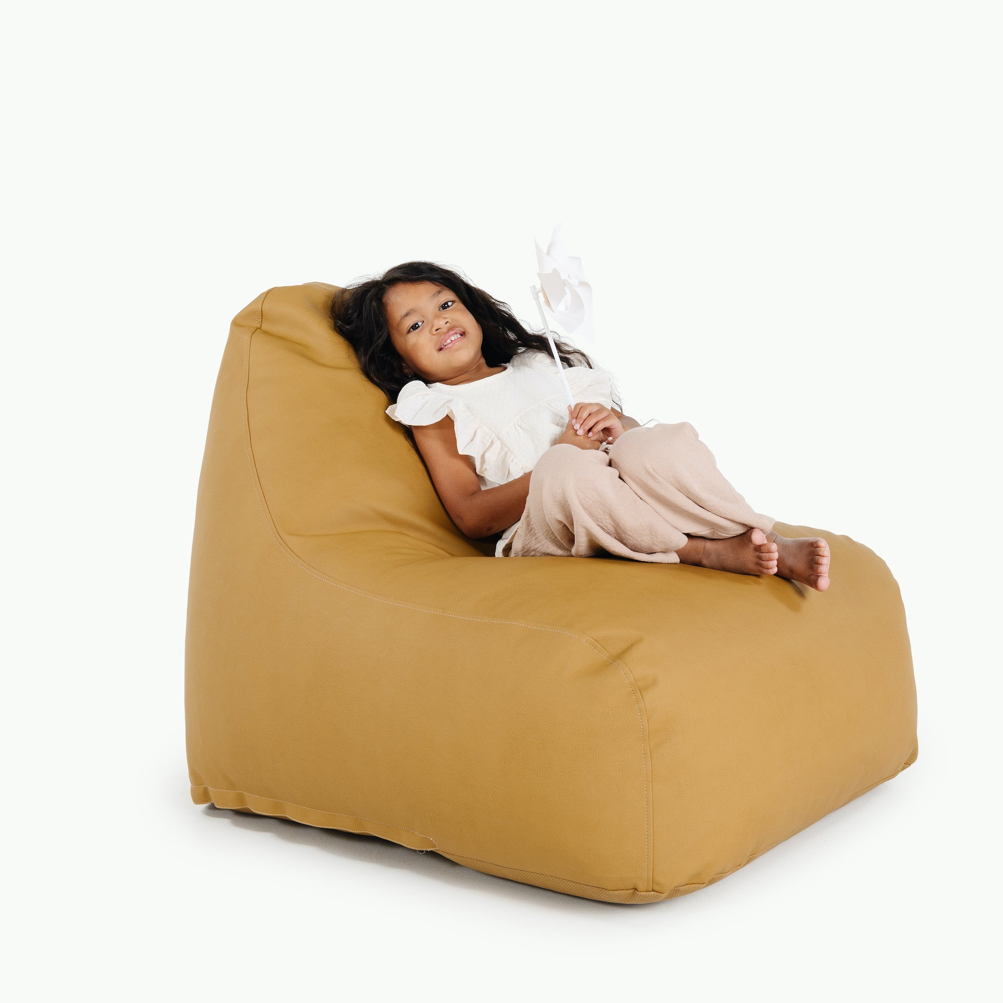 Ochre (on sale)@Kid sitting on the Ochre Lounger