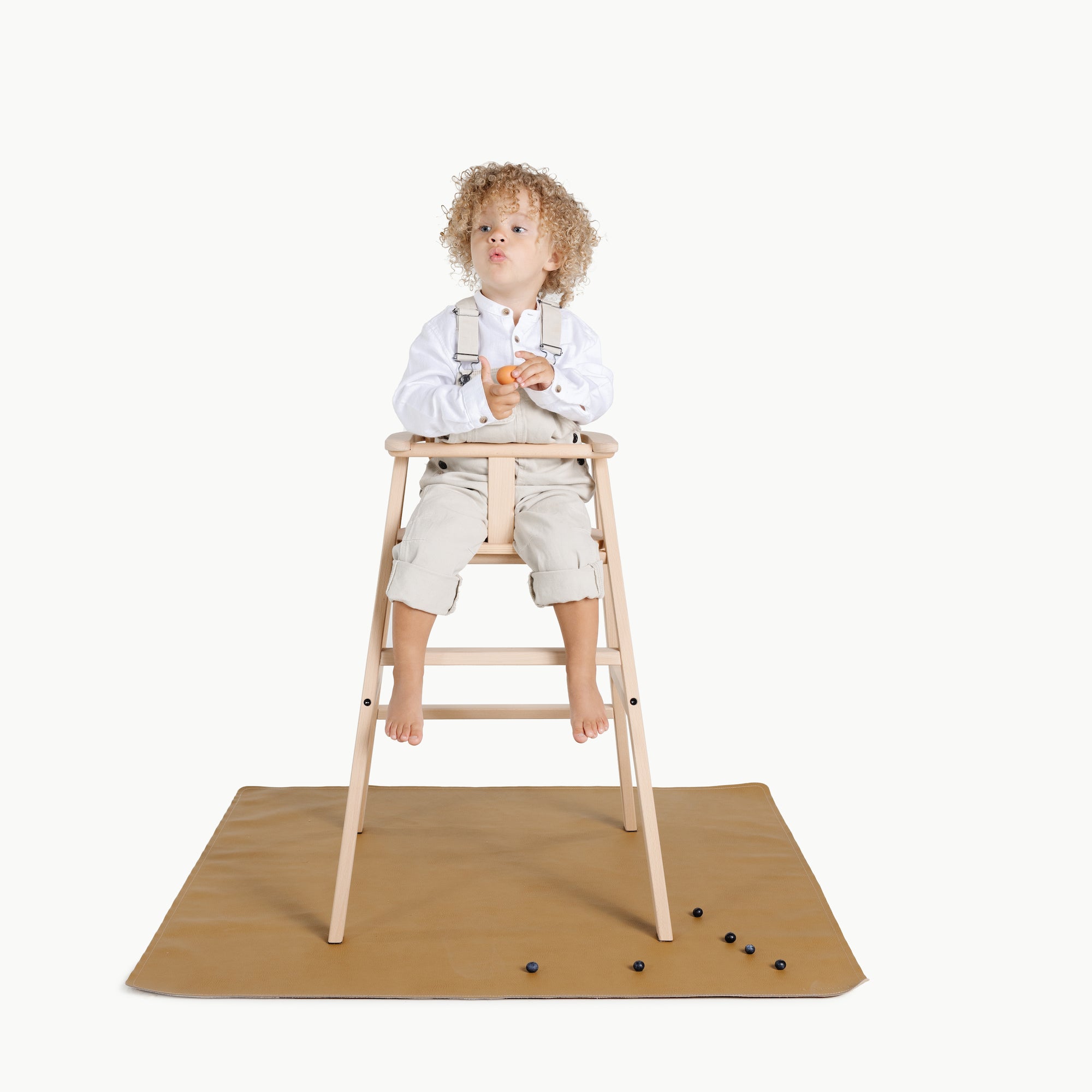 Ochre (on sale)@Baby in a highchair on the Ochre Mini Mat