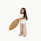 Ochre (on sale) / Square@Kid holding the Ochre Mini Square Floor Cushion