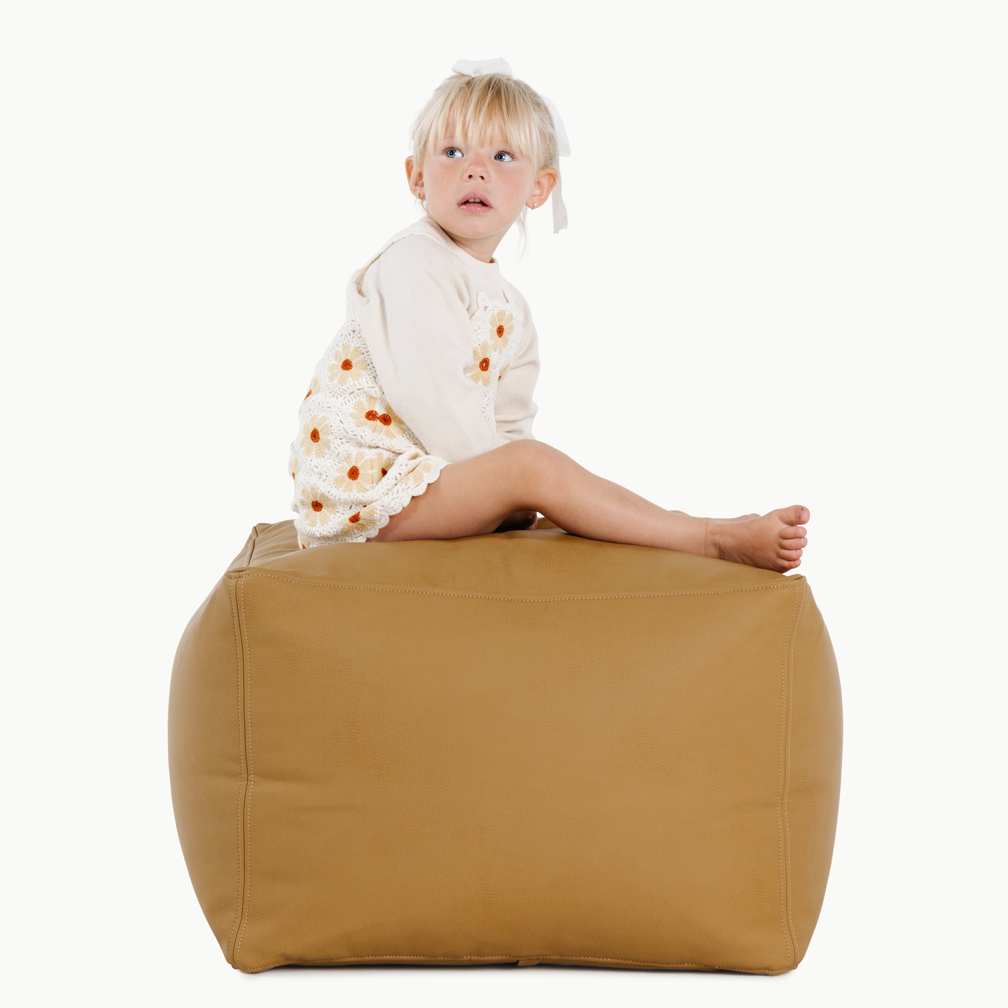 Ochre (on sale)@Kid sitting on the Ochre Square Pouf