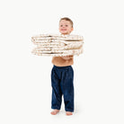 Paris@kid holding the paris ball pit folded up