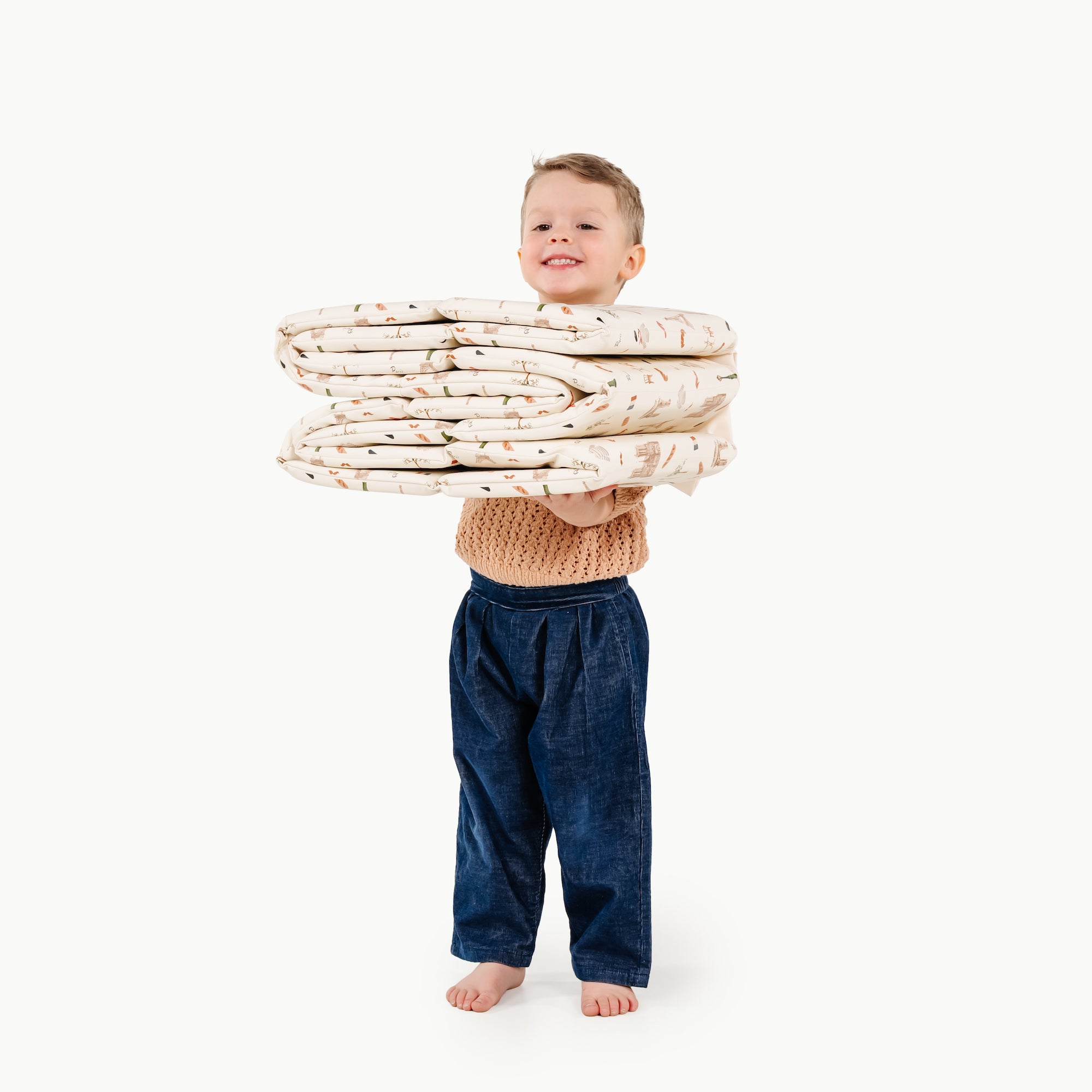 Paris@kid holding the paris ball pit folded up