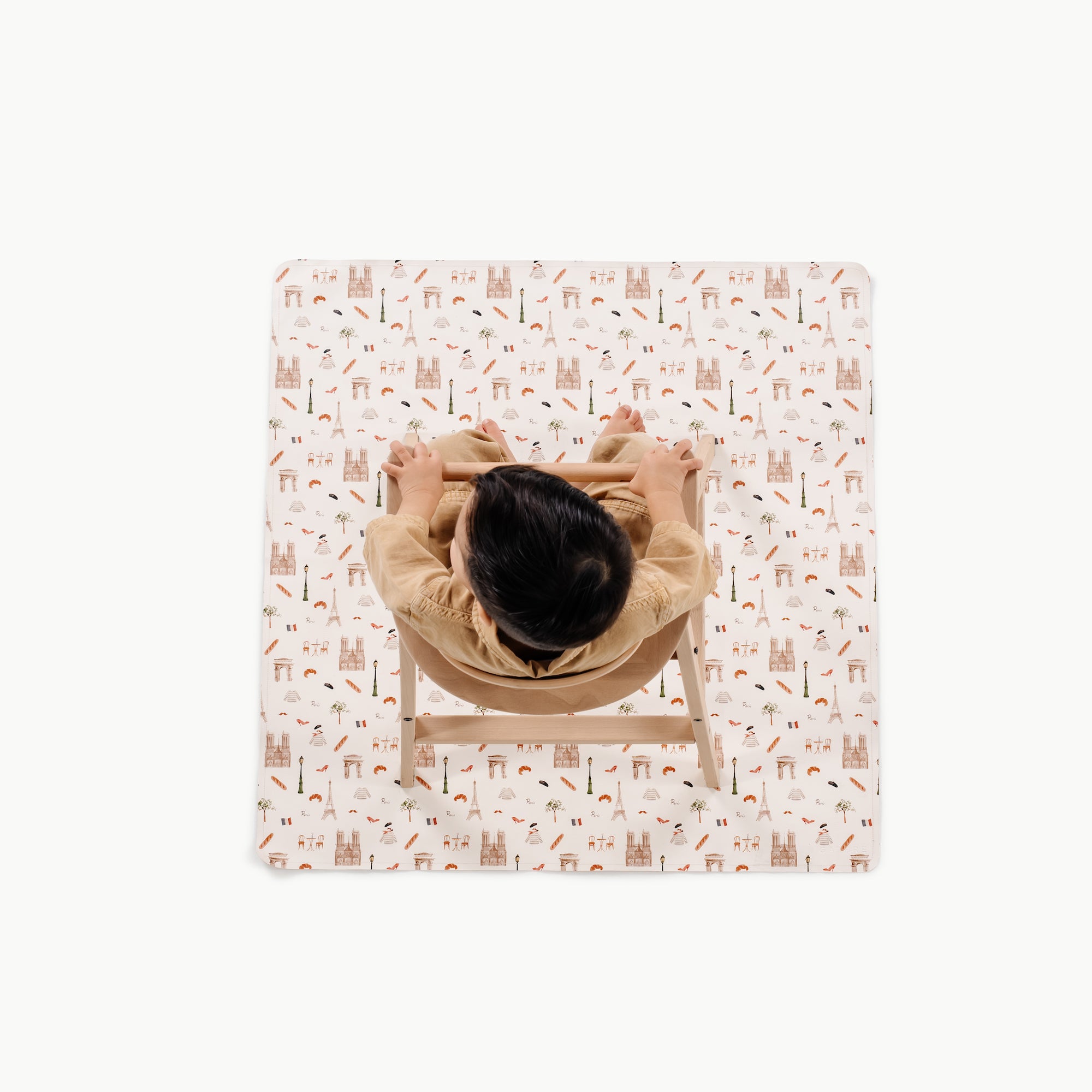 Paris (on sale)@overhead of kid in a highchair on the paris mini mat