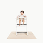 Petal (on sale)@baby in a highchair on the petal mini mat