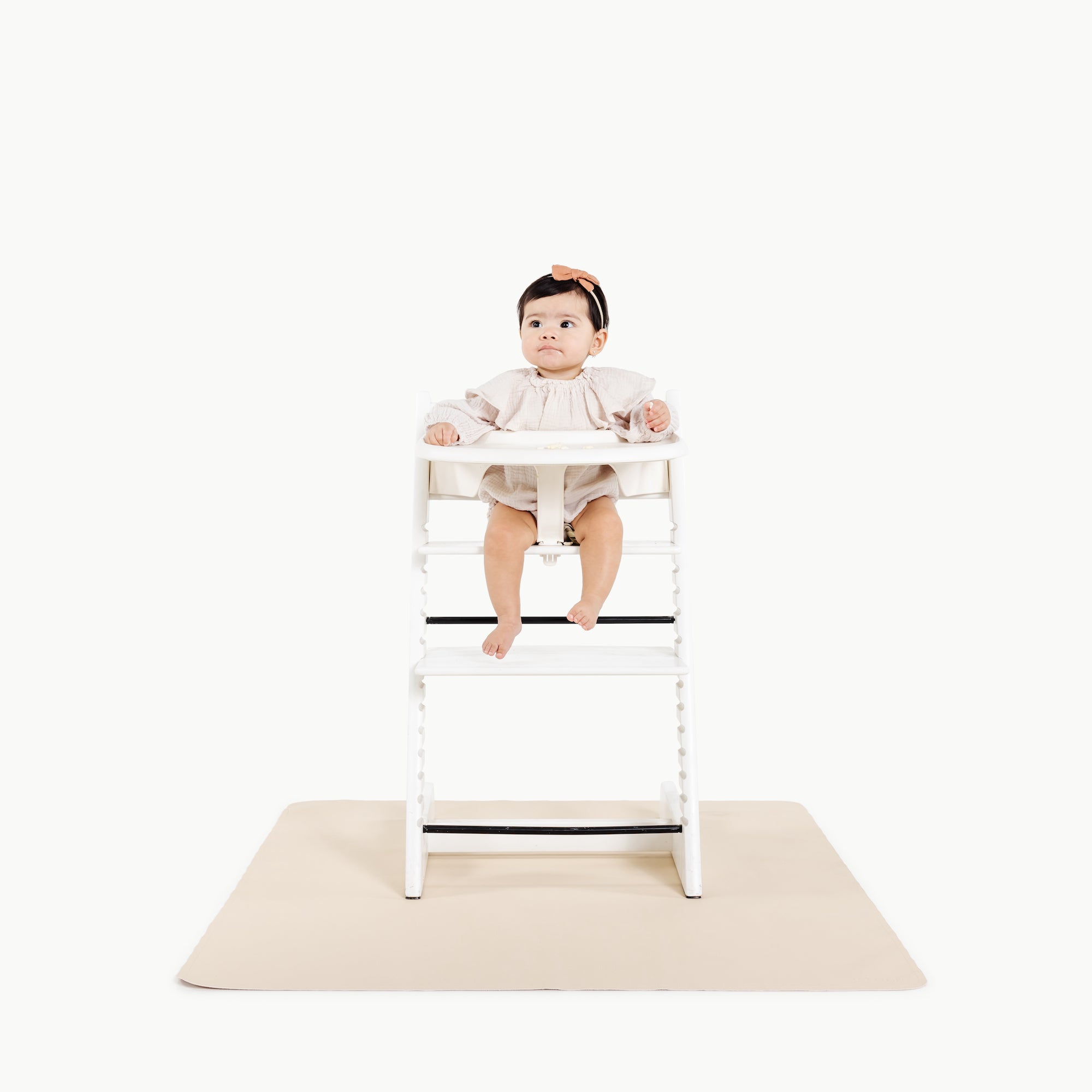 Petal (on sale)@baby in a highchair on the petal mini mat