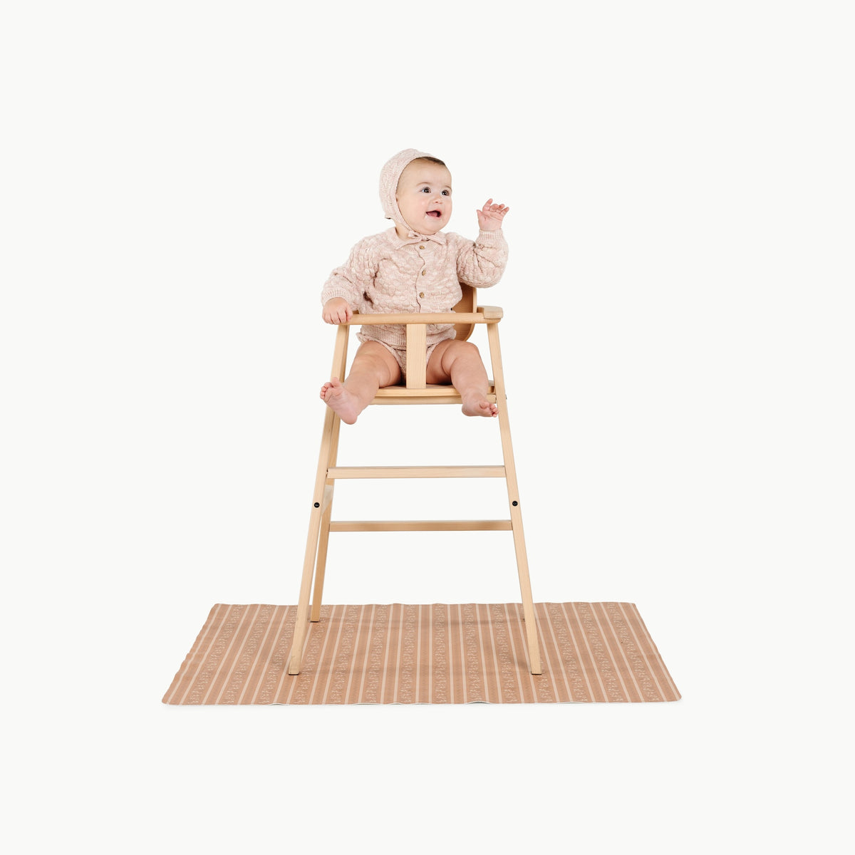 Floral Stripe@child in a highchair on the mini mat