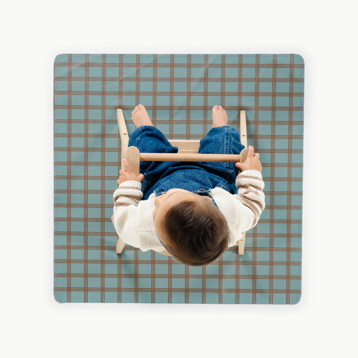 Rustic Plaid@overhead of a child in a highchair on the mini mat