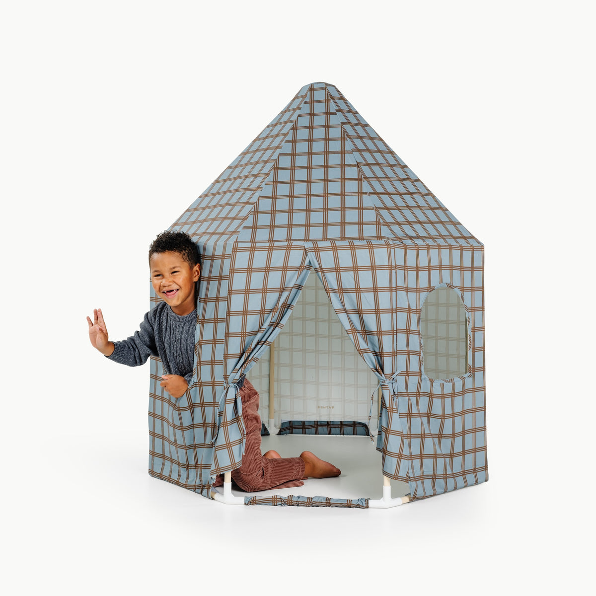 Rustic Plaid@little boy playing in the play tent