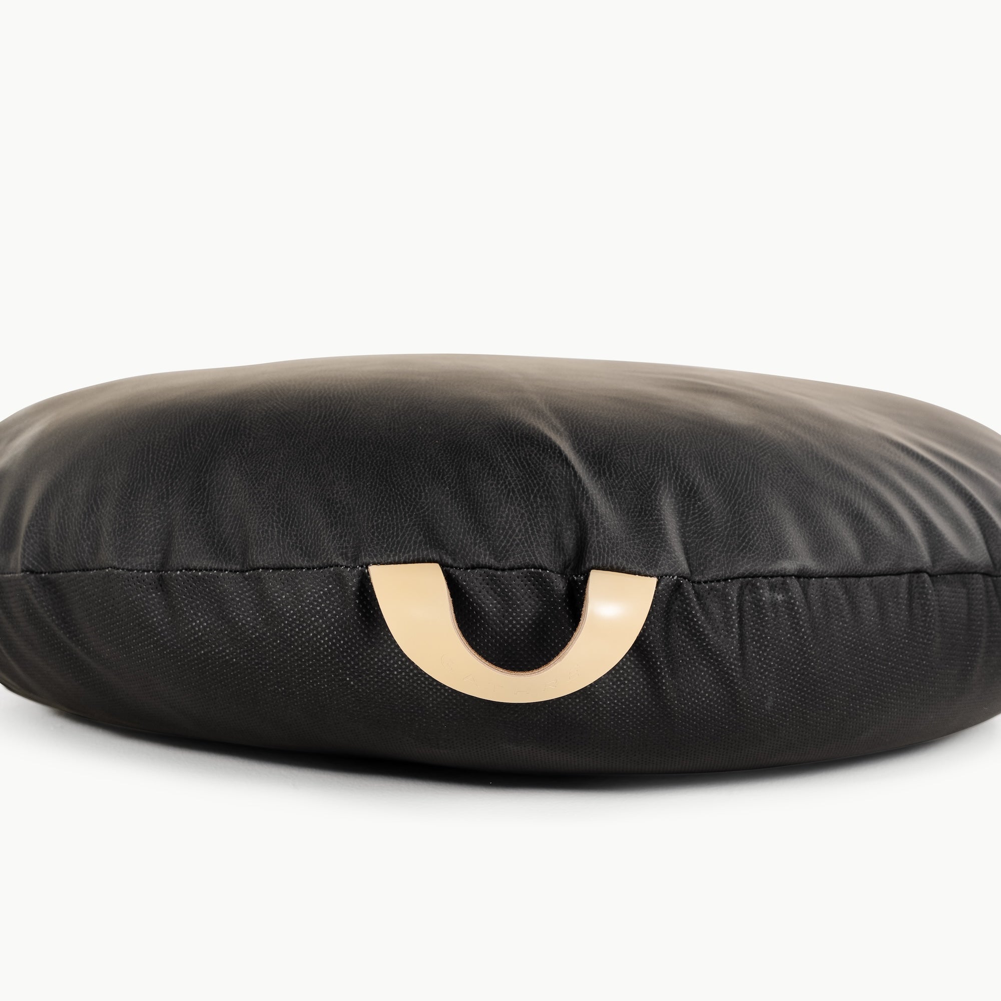 Raven / Circle@handle detail of the Raven Circle Floor Cushion