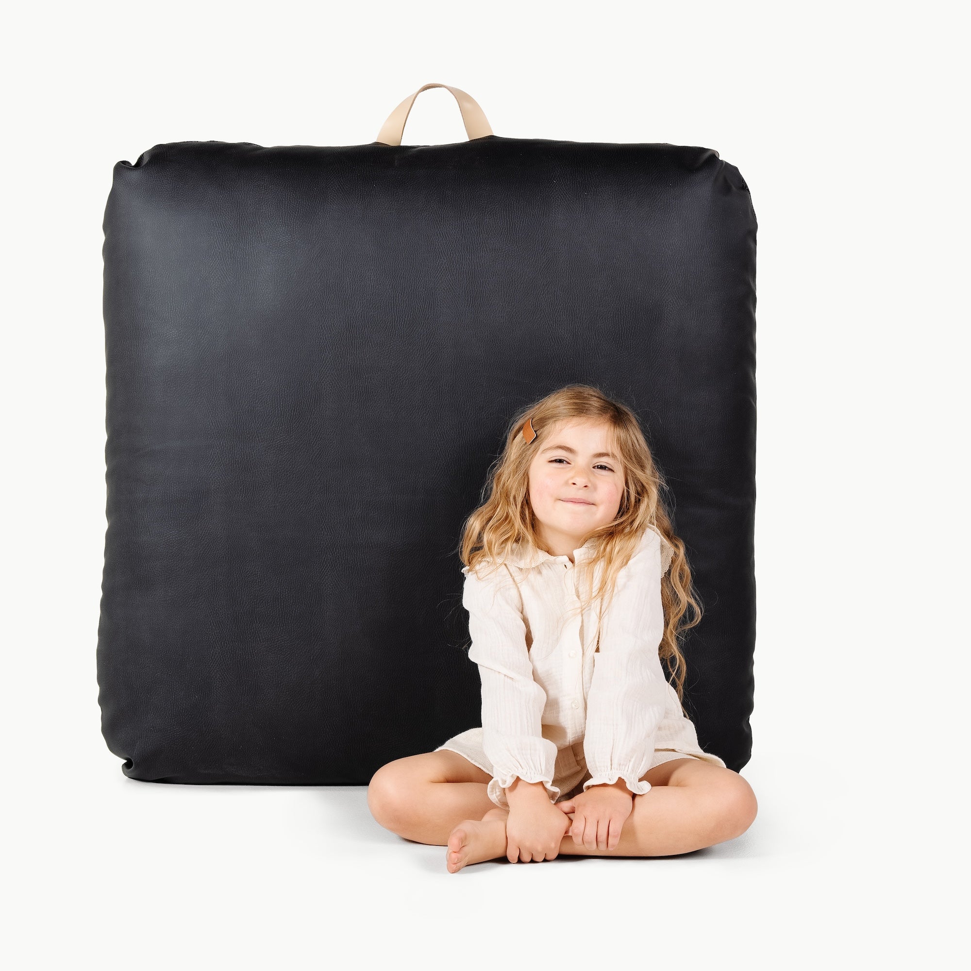 Raven  (on sale) / Square@little girl in front of the Raven Square Floor Cushion