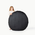 Raven (on sale) / Circle@little girl holding the Raven Circle Floor Cushion