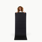 Raven (on sale)@woman holding up the large home mat