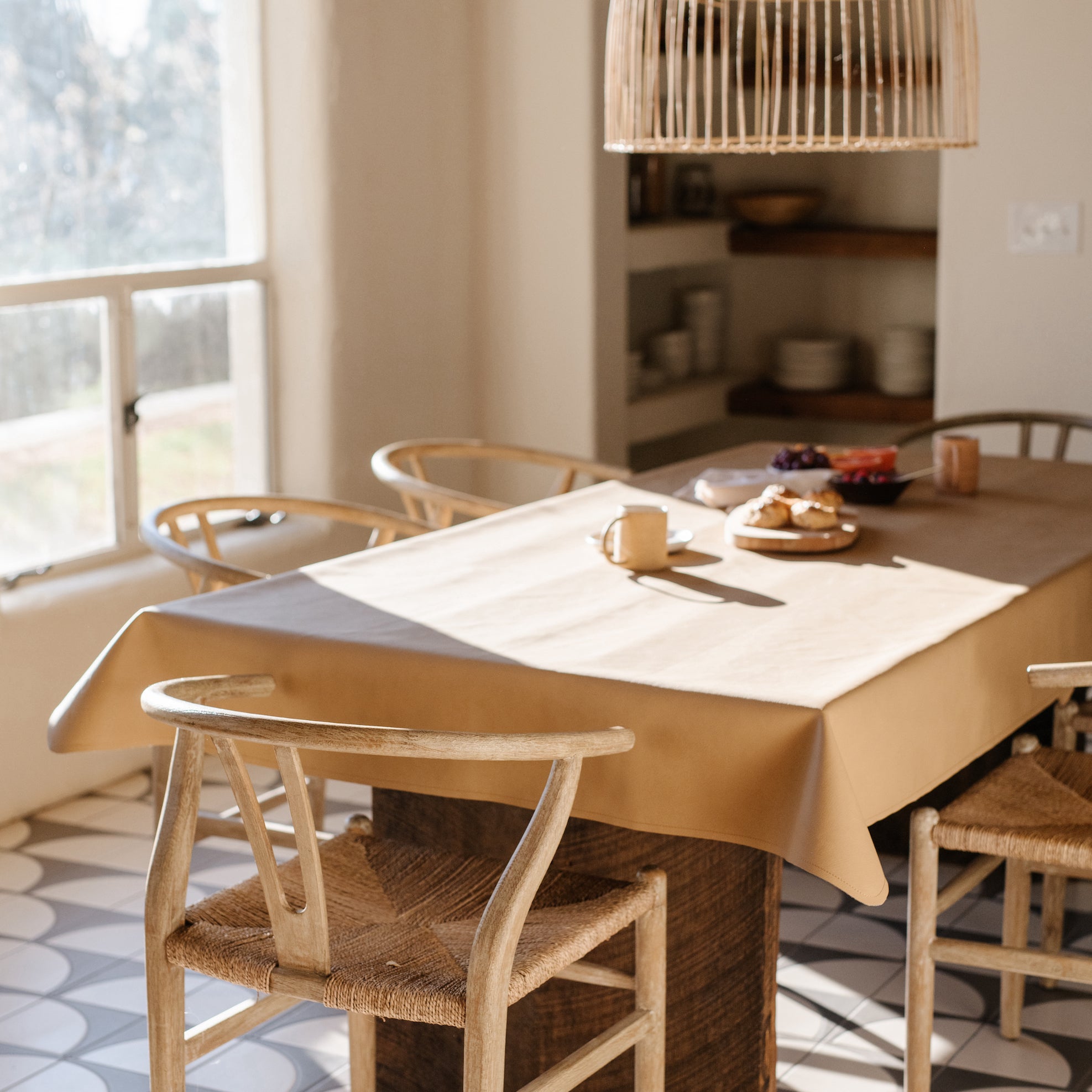 Gathre Tablecloth on table with food in a home.