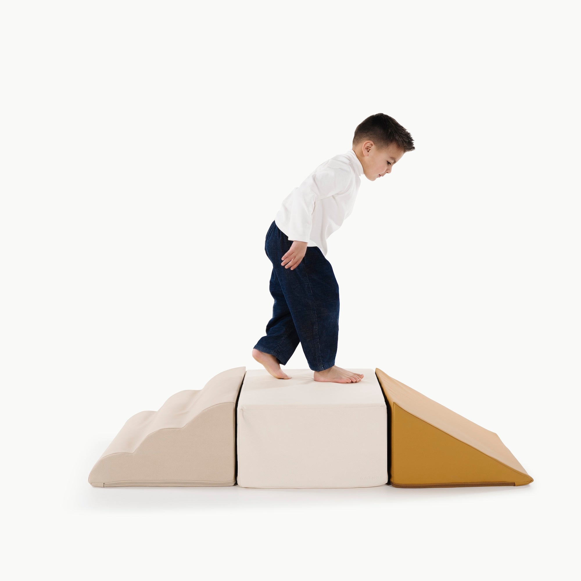 Ivory • Millet • Saffron@little boy playing on the mini climber