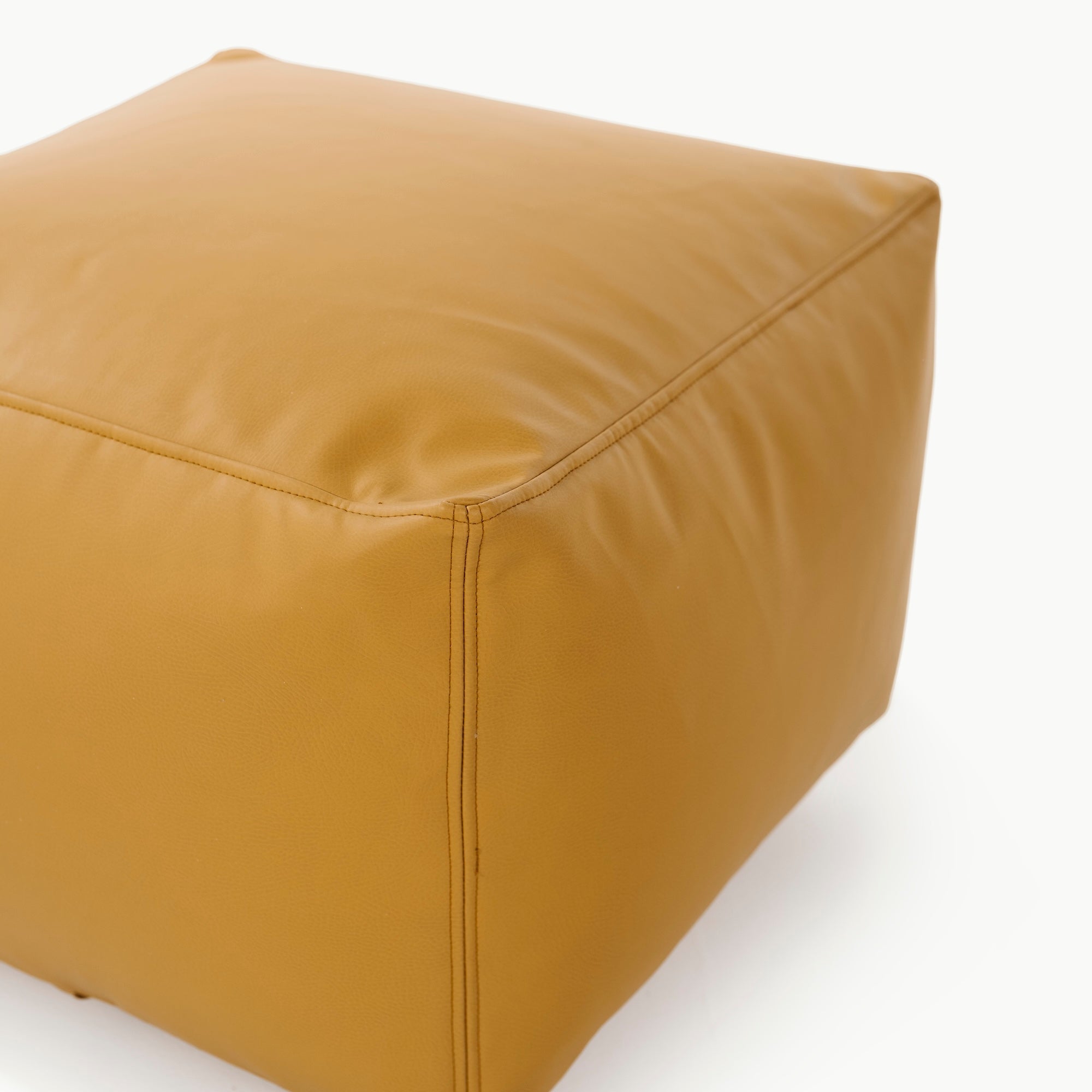 Saffron@edging detail on a square pouf