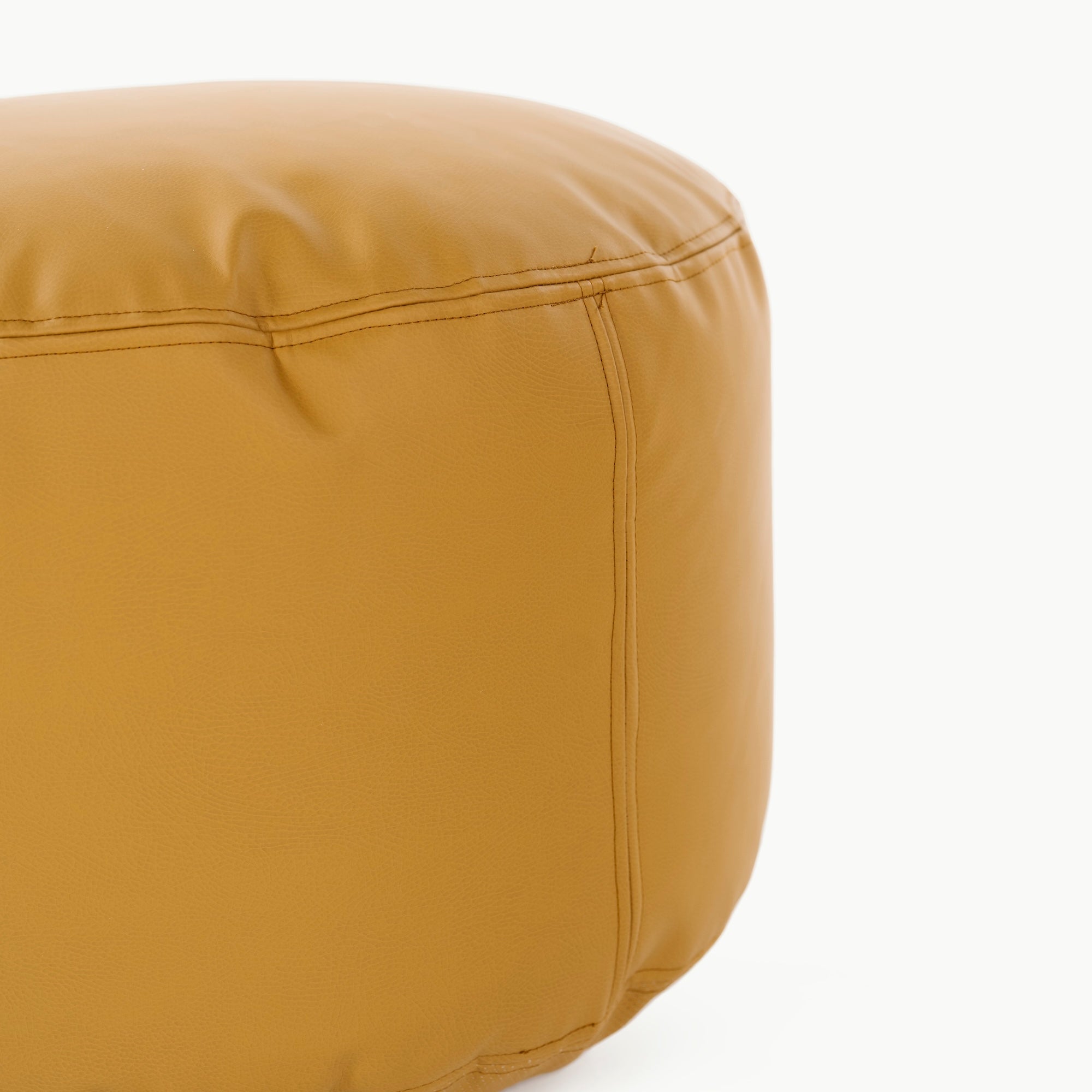 Saffron@edging detail on a circle pouf