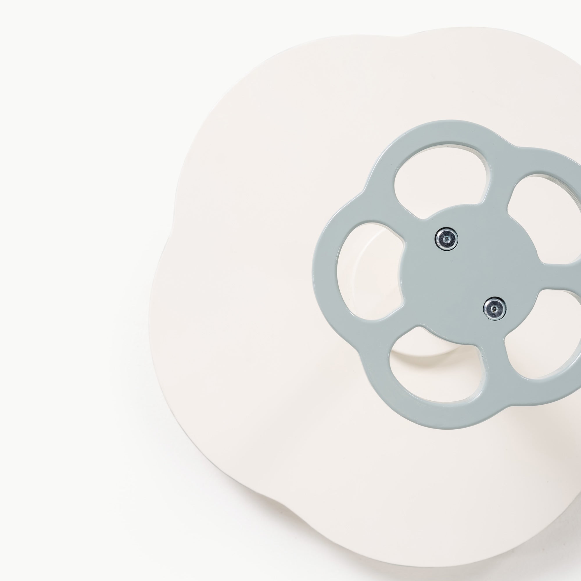 Harbor@close up of the sit and spin, with blue handle and white base