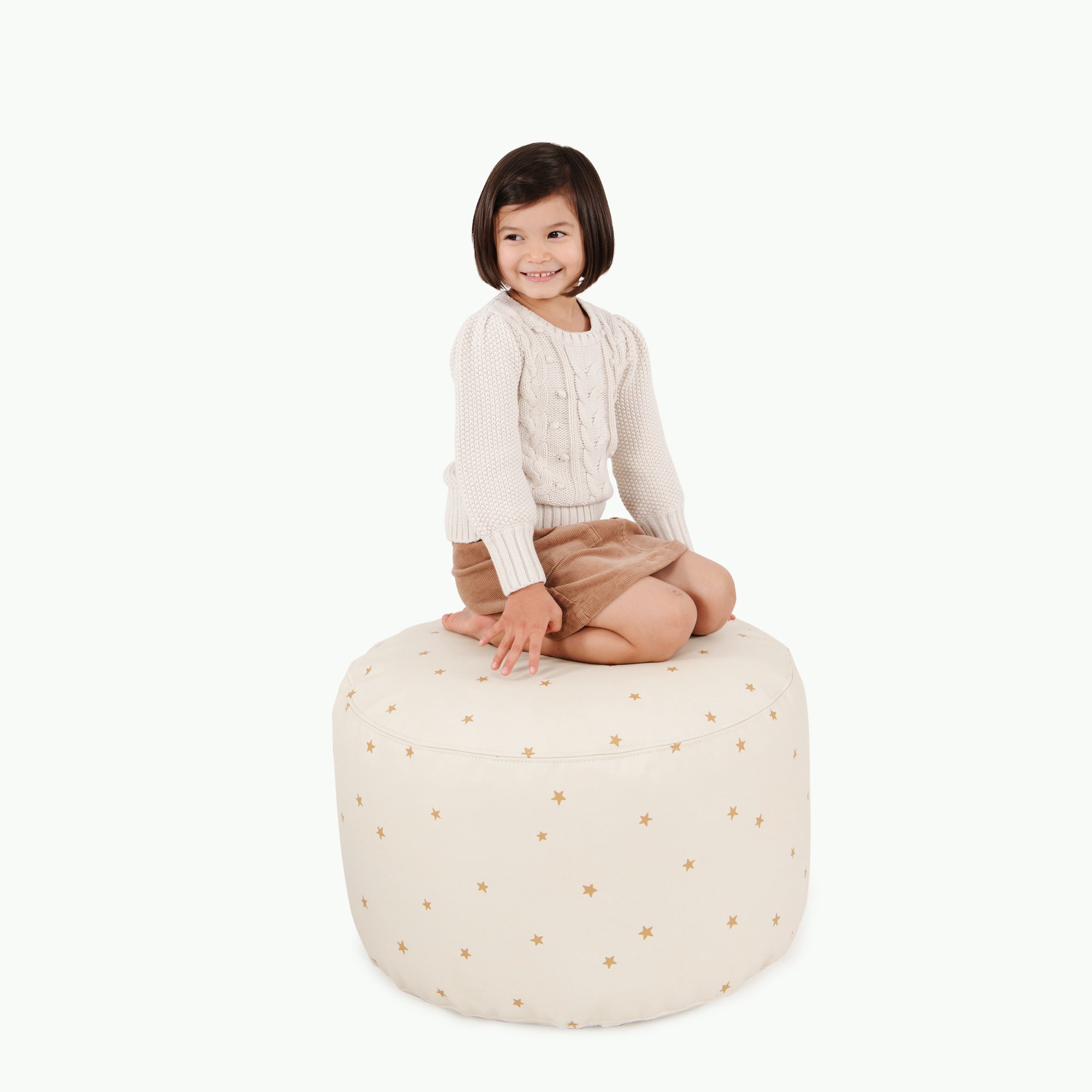 Stars (on sale)@kid sitting on the stars circle pouf
