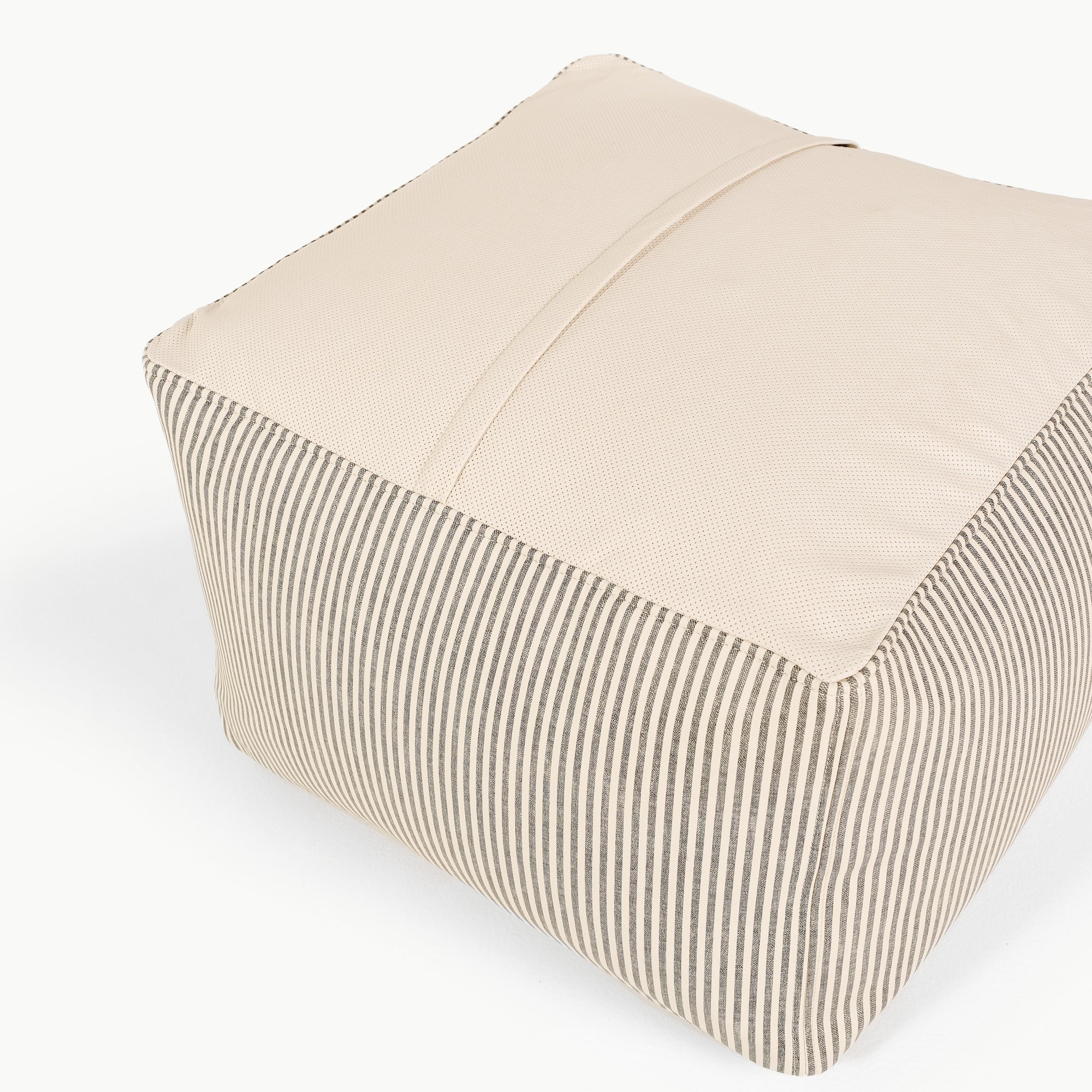 Stone Stripe@perforated bottom detail of the Stone Stripe Square Pouf