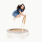 Stone Stripe@little girl jumping on trampoline
