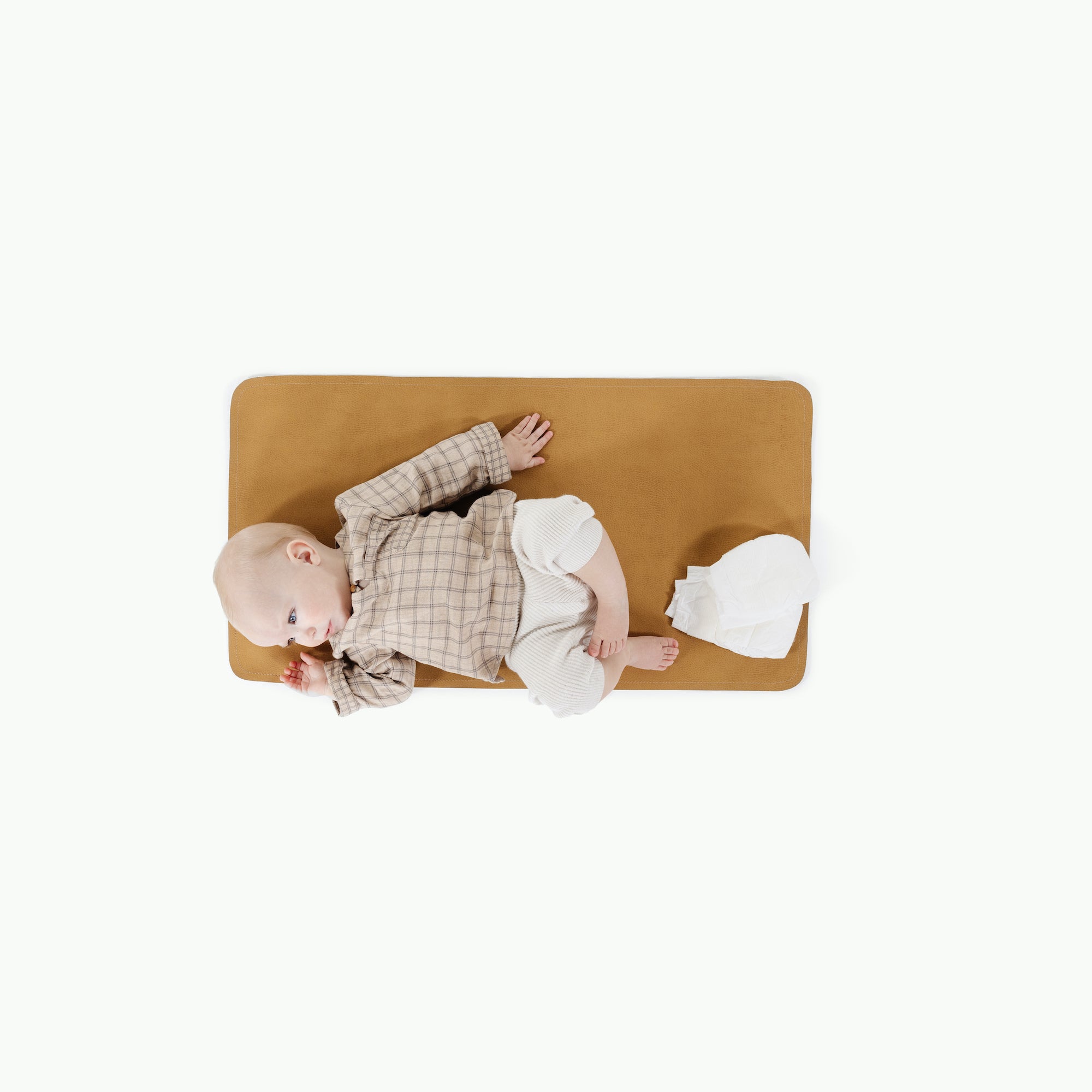 Tassel (on sale)@overhead of baby laying on the tassel micro+ mat