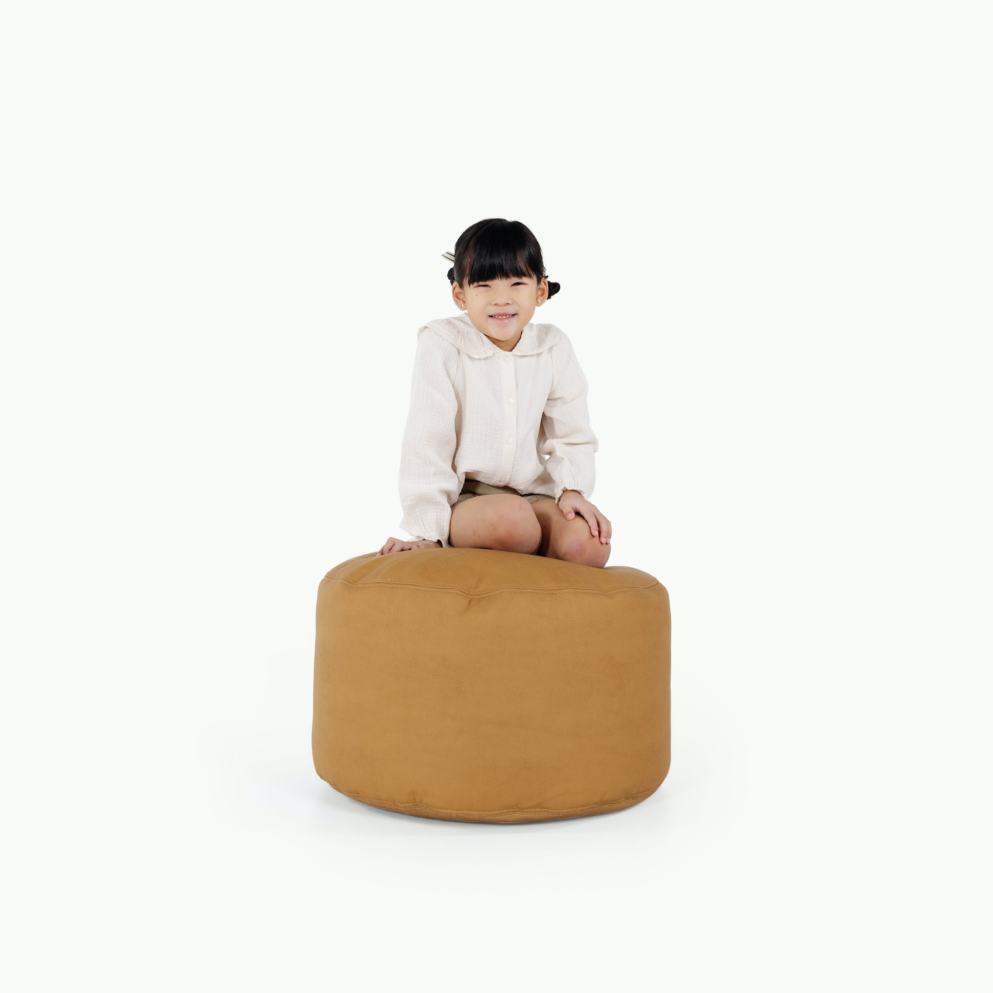 Tassel (on sale)@little girl sitting on pouf