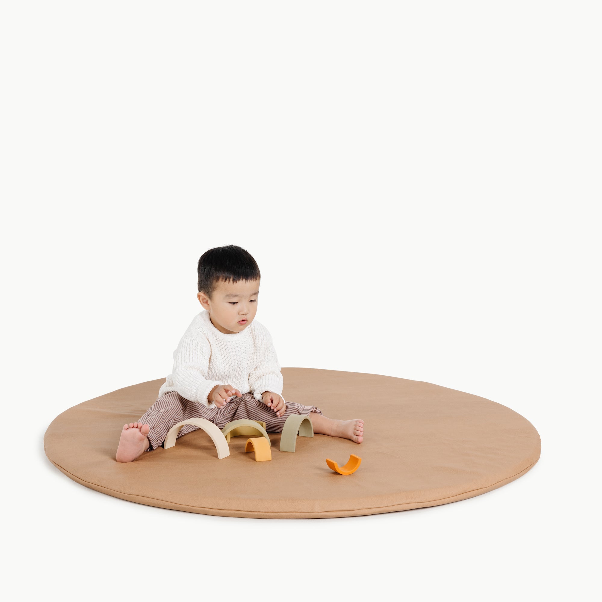 Terra (on sale)@kid playing on the terra padded midi circle
