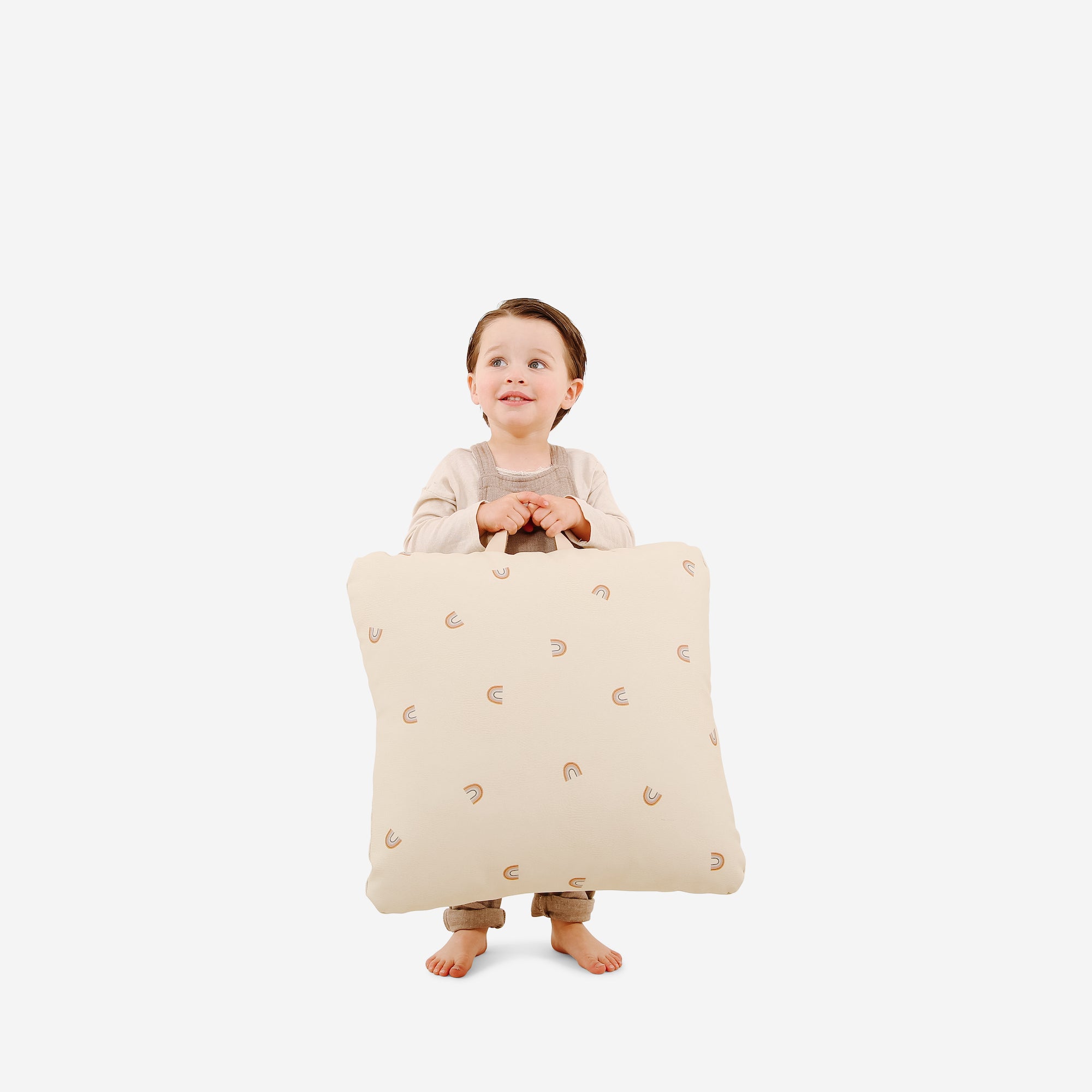Tiny Wings (on sale) / Square@kid holding the tiny wings mini square floor cushion