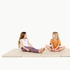 Millet@Kids sitting on the Millet Tumbling Mat