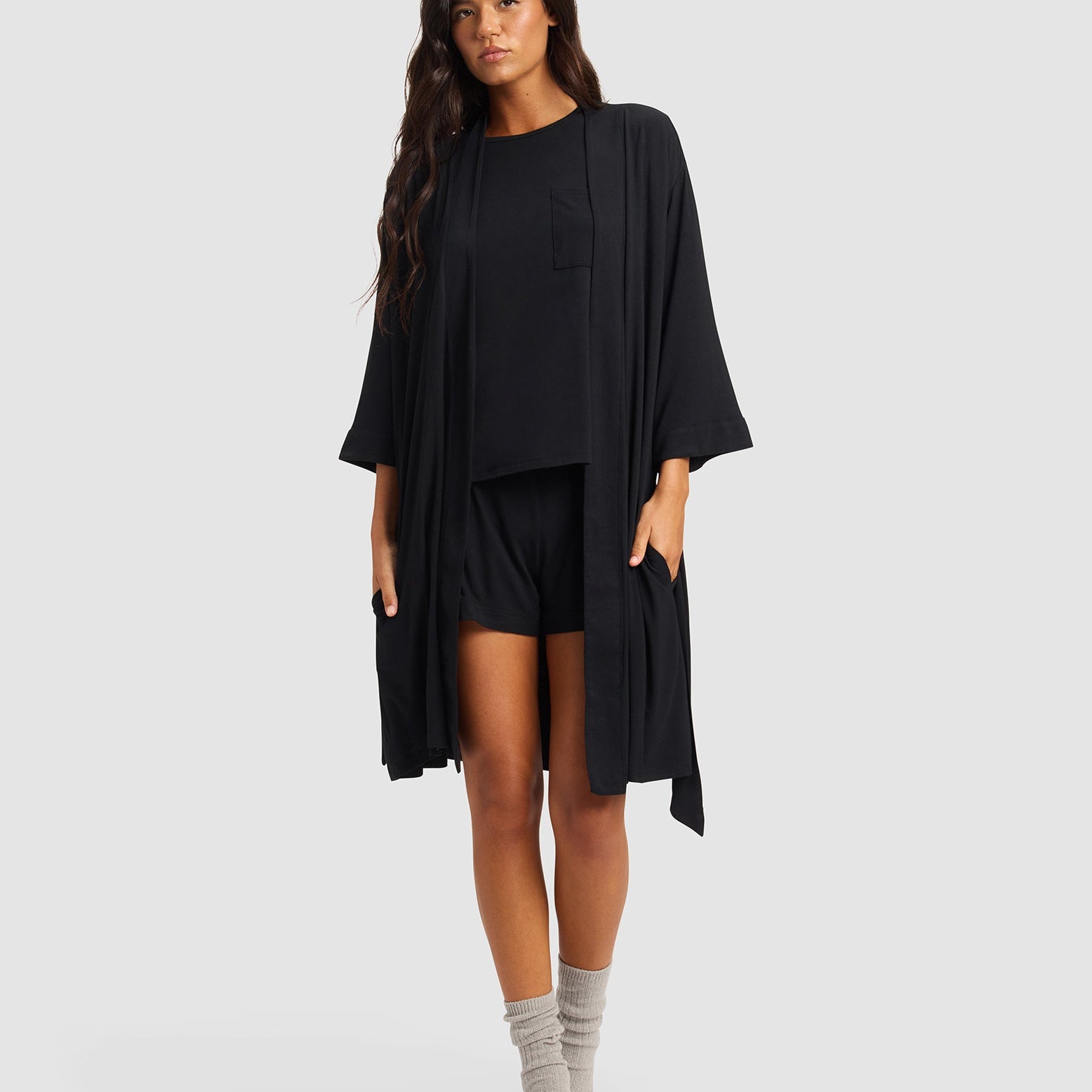 Black@woman wearing a black cozy earth robe