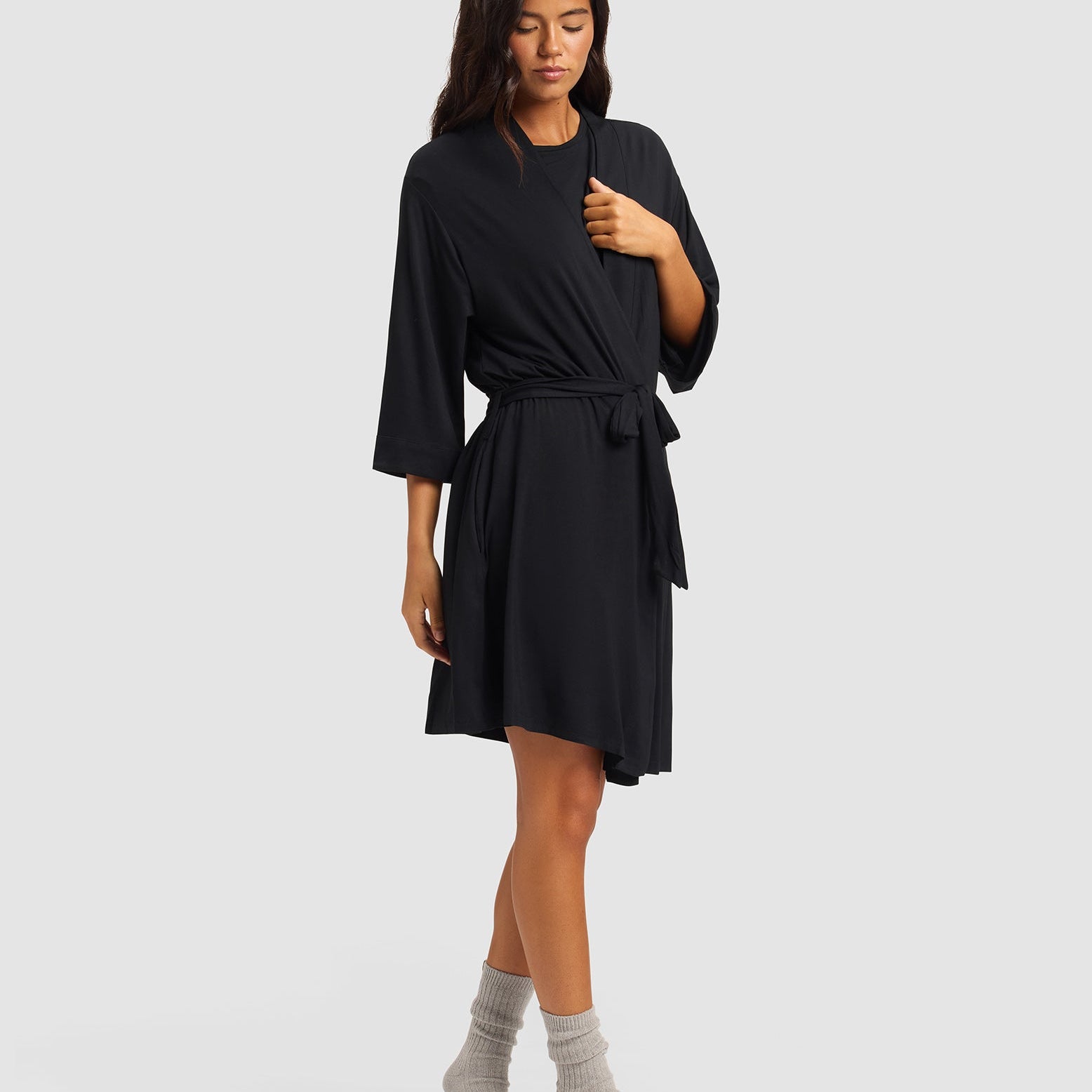 Black@woman wearing a black cozy earth robe