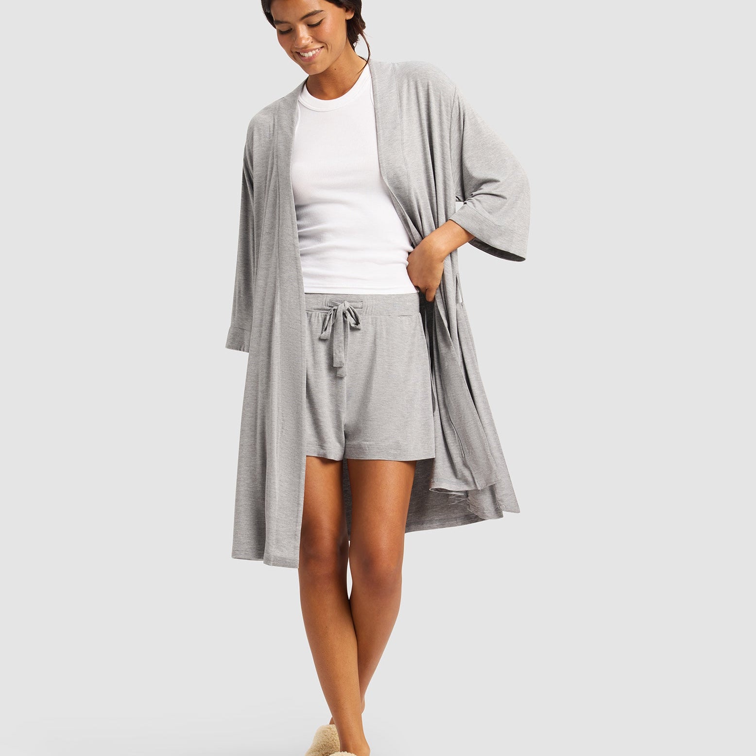Grey@woman wearing a grey cozy earth robe