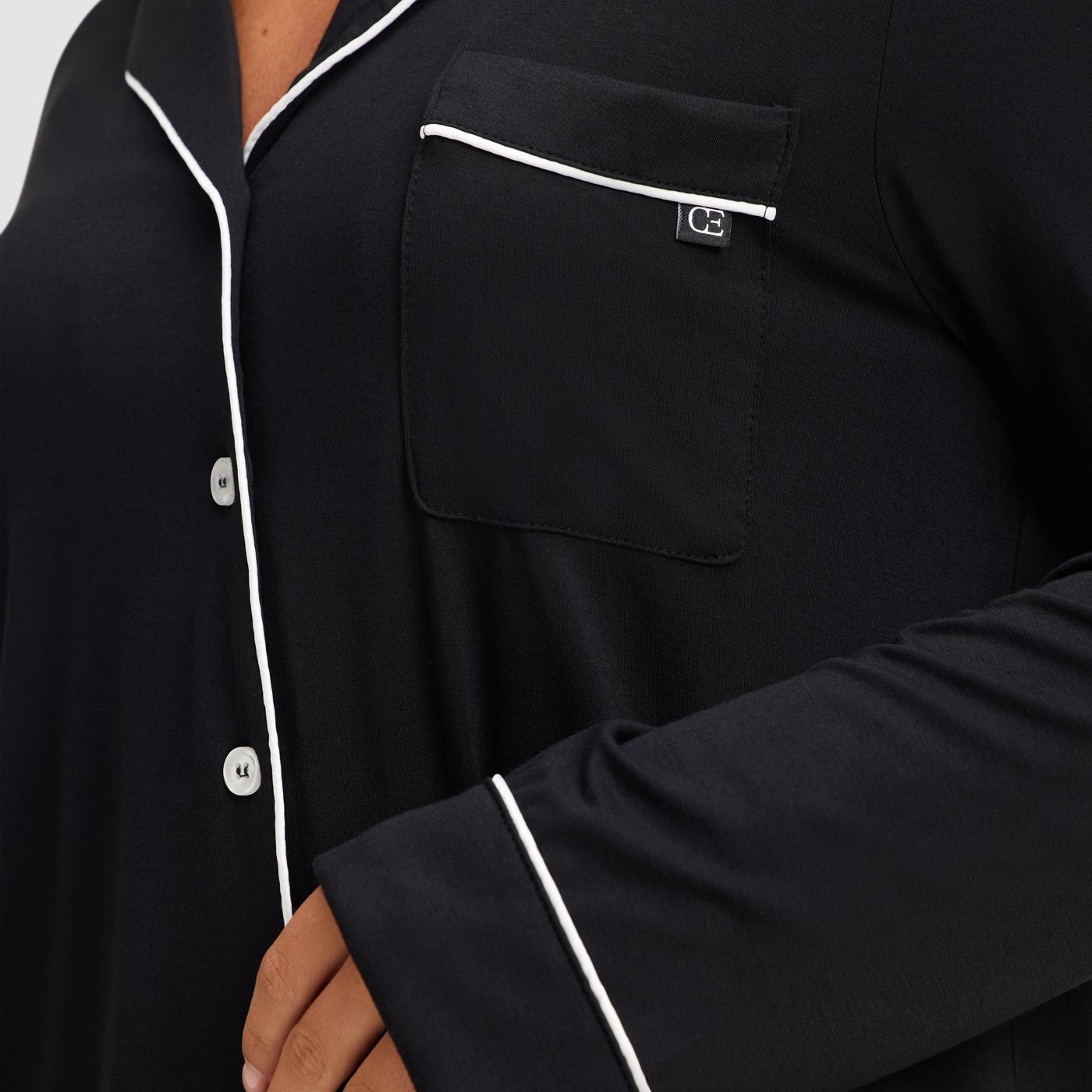 Black@woman wearing black cozy earth pajamas