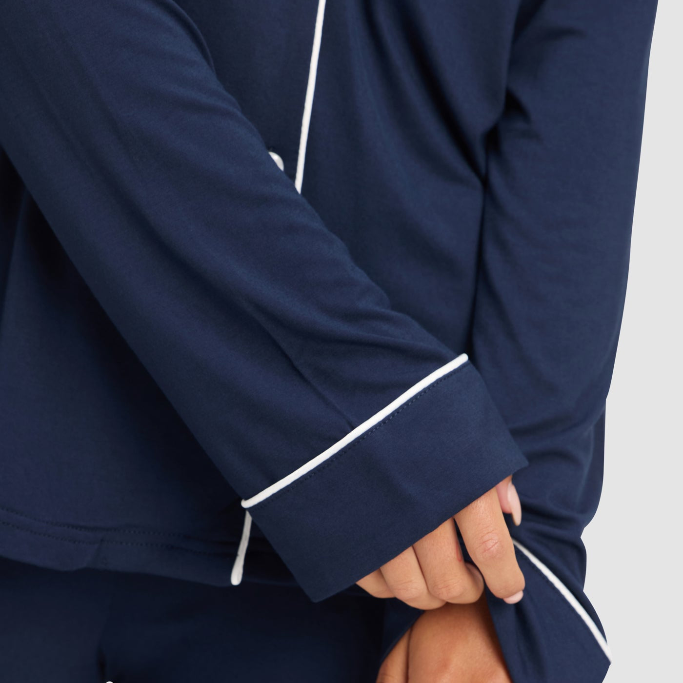 Navy@woman wearing navy cozy earth pajamas