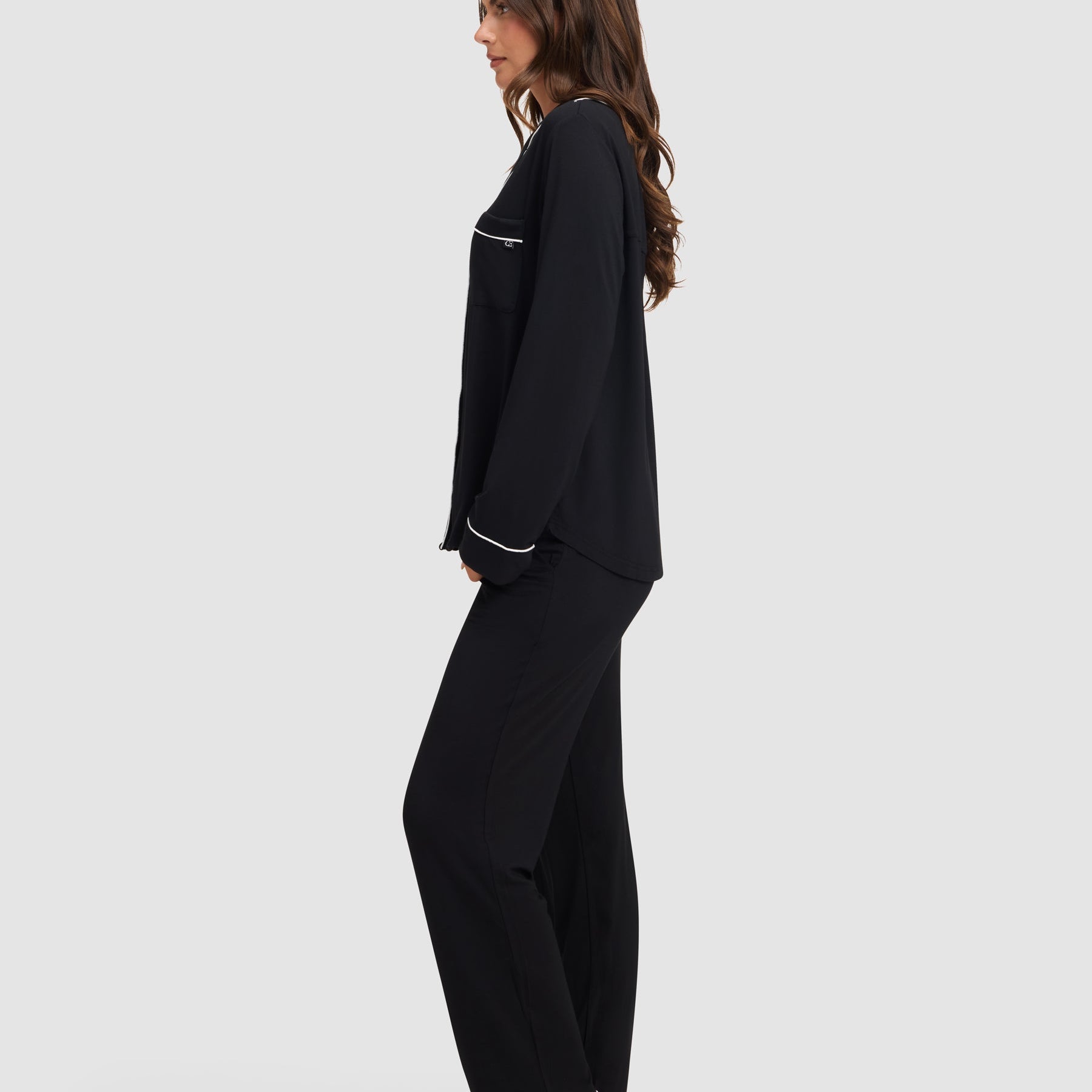 Black@woman wearing black cozy earth pajamas