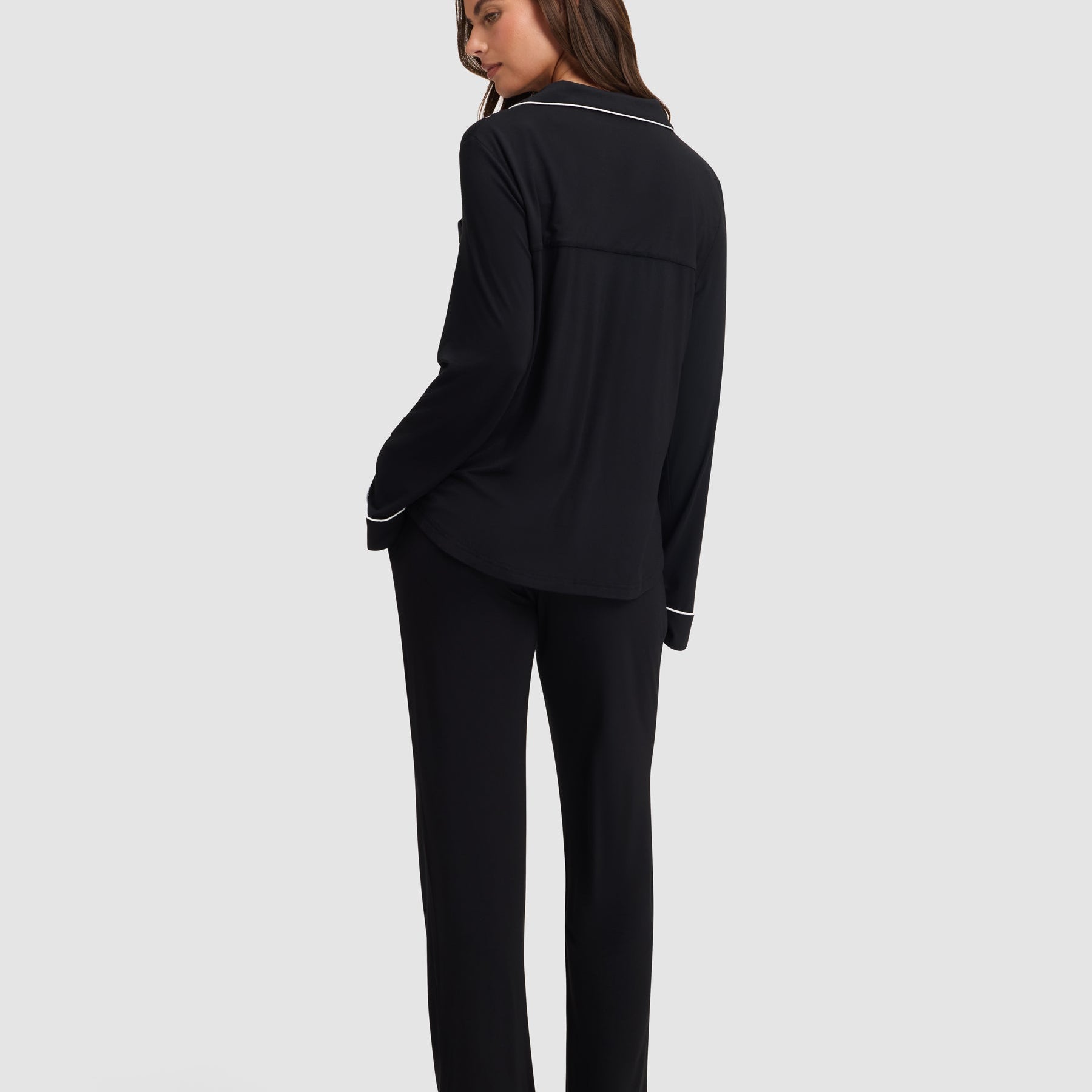 Black@woman wearing black cozy earth pajamas