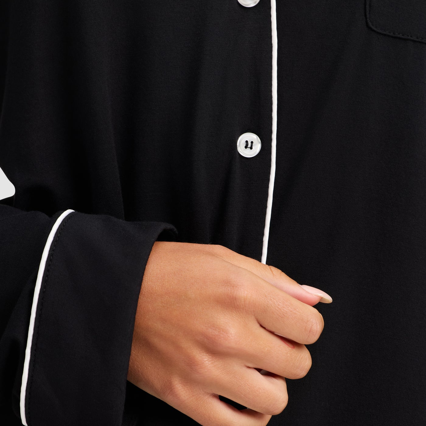 Black@woman wearing black cozy earth pajamas