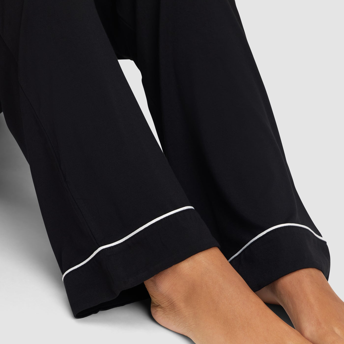 Black@woman wearing black cozy earth pajamas