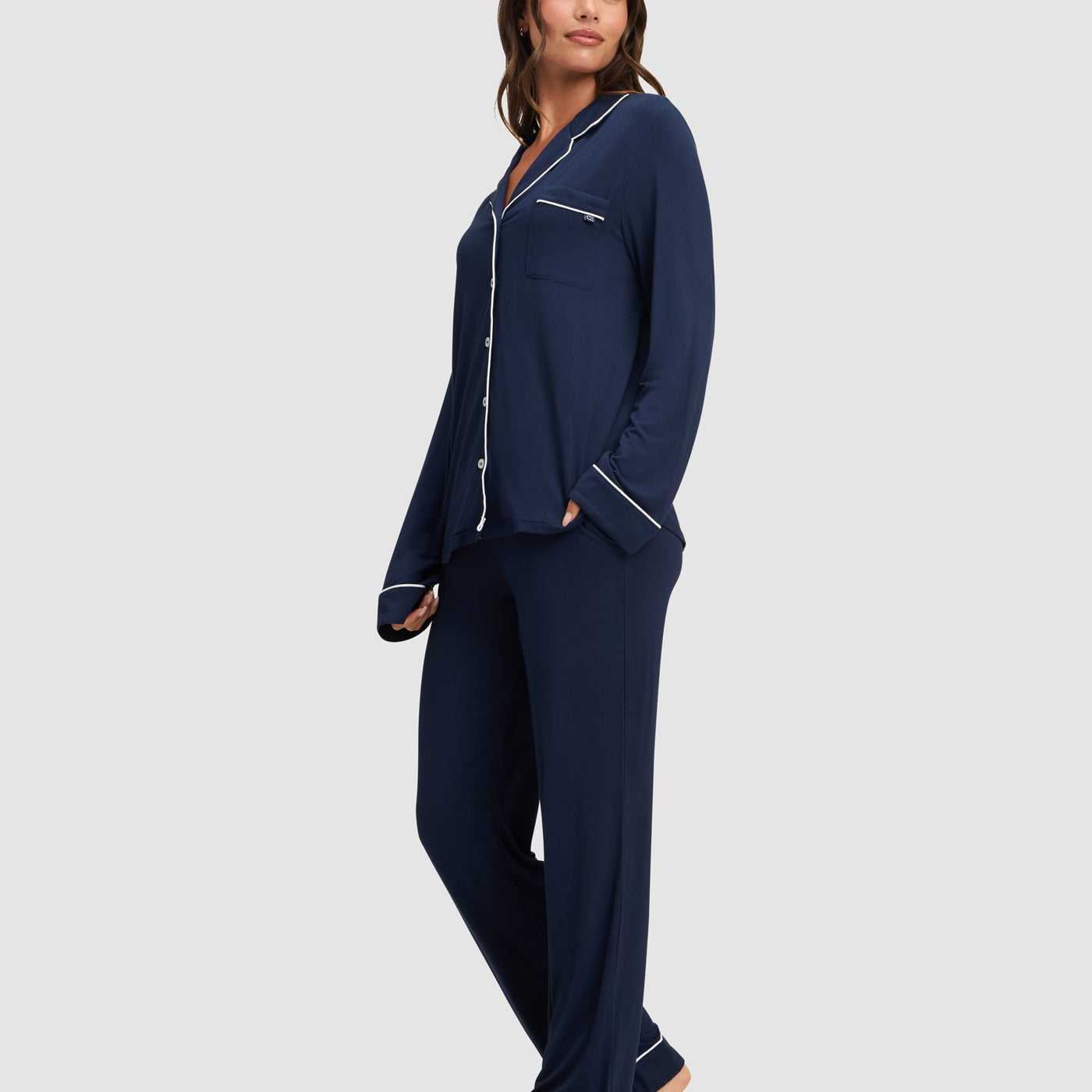 Navy@woman wearing navy cozy earth pajamas