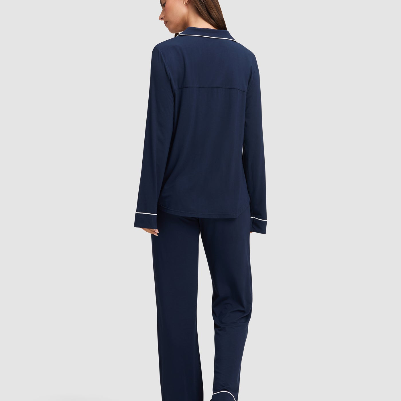 Navy@woman wearing navy cozy earth pajamas