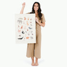 Animal Alphabet@Woman holding the Animal Alphabet Poster