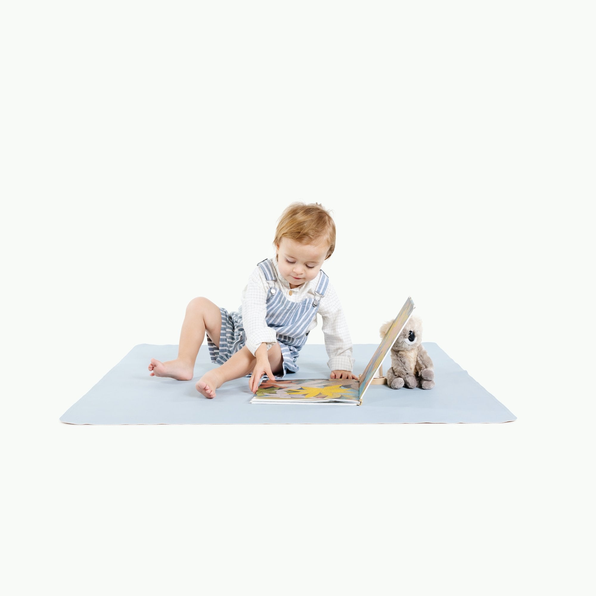 Beau@Little boy sitting on the Beau Mini Mat