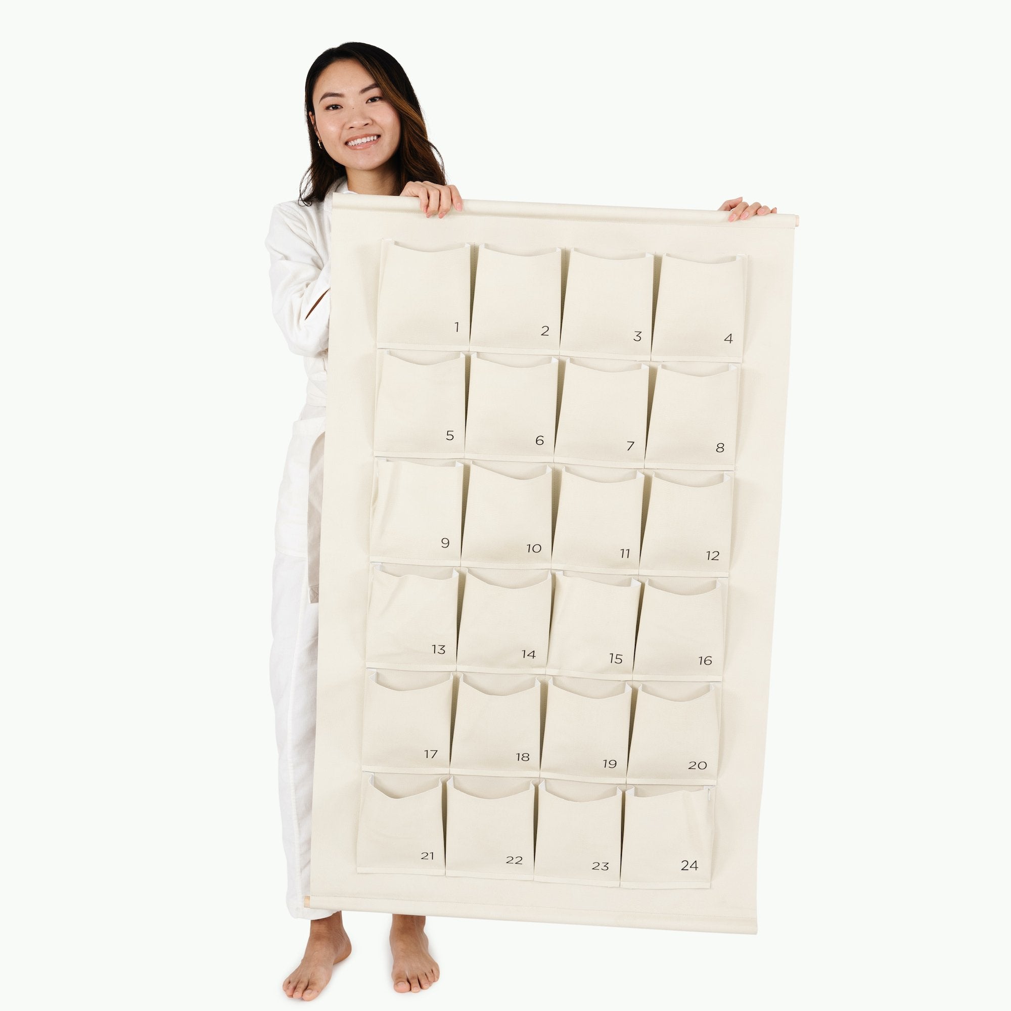 Ivory@Woman holding the Large Ivory Advent Calendar