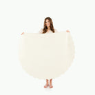 Ivory Scallop (on sale) / Circle@Woman holding the Ivory Scallop Circle Midi Mat