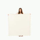 Ivory Scallop (on sale) / Square@Woman holding the Ivory Scallop Square Midi Mat