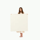 Ivory Scallop@Woman holding the Ivory Scallop Mini Mat